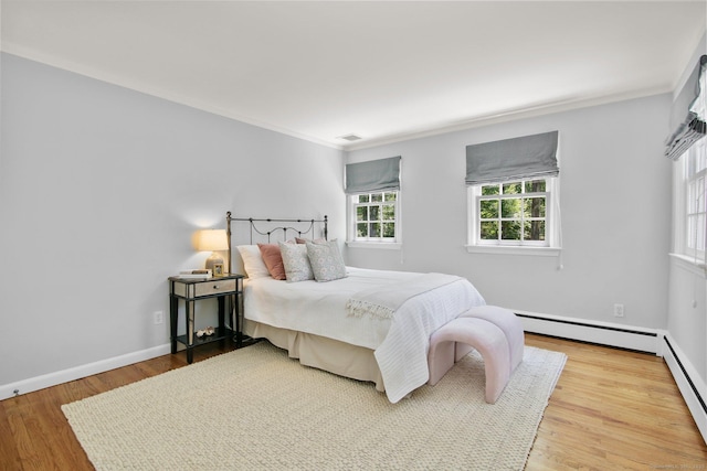 151 Woodridge Dr, New Canaan, CT 06840 - bedroom featuring crown molding, wood finished floors, baseboards, and baseboard heating