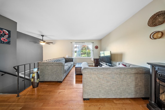 3 Celentano Dr, Naugatuck, CT 06770 - living room featuring wood finished floors, a wood stove, lofted ceiling, and a ceiling fan