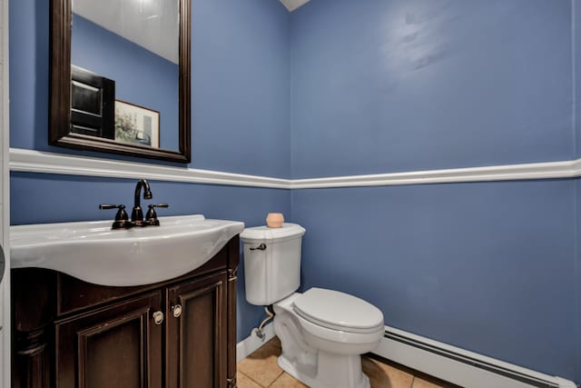 233 Church St, Hebron, CT 06231 - bathroom featuring baseboard heating, toilet, tile patterned floors, vanity, and baseboards