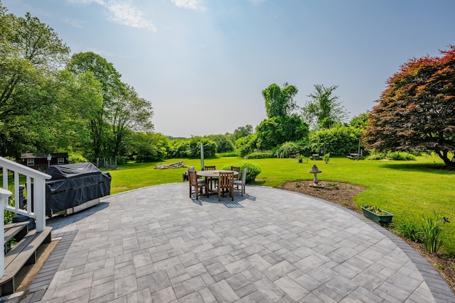 233 Church St, Hebron, CT 06231 - view of patio featuring outdoor dining space, a grill, and view of wooded area