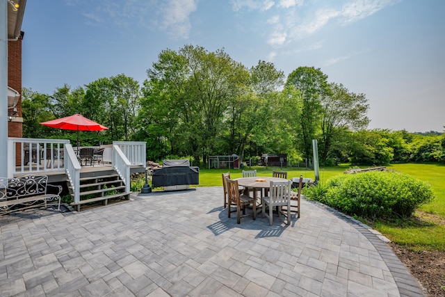 233 Church St, Hebron, CT 06231 - view of patio featuring outdoor dining space, a deck, and view of wooded area