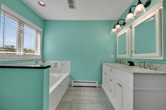 233 Church St, Hebron, CT 06231 - bathroom featuring a baseboard radiator, double vanity, a garden tub, and baseboards