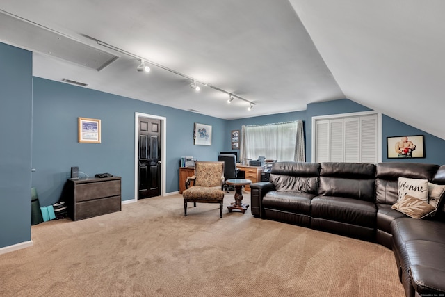 233 Church St, Hebron, CT 06231 - carpeted living area with attic access, track lighting, baseboards, and vaulted ceiling
