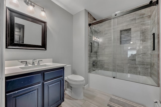 233 Church St, Hebron, CT 06231 - full bathroom with vanity, toilet, enclosed tub / shower combo, baseboards, and wood finished floors