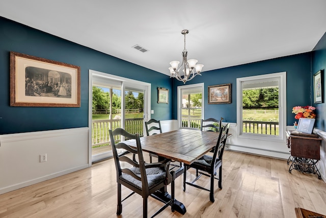 233 Church St, Hebron, CT 06231 - dining area with baseboard heating, a chandelier, healthy amount of natural light, and light wood-style floors