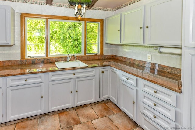 3 Glen Dr, Old Saybrook, CT 06475 - kitchen featuring healthy amount of natural light, decorative backsplash, and white cabinetry