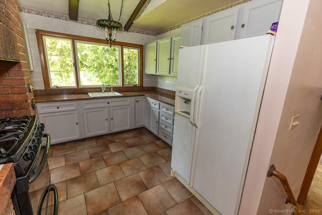 3 Glen Dr, Old Saybrook, CT 06475 - kitchen with white fridge with ice dispenser, gas stove, white cabinets, and dark countertops