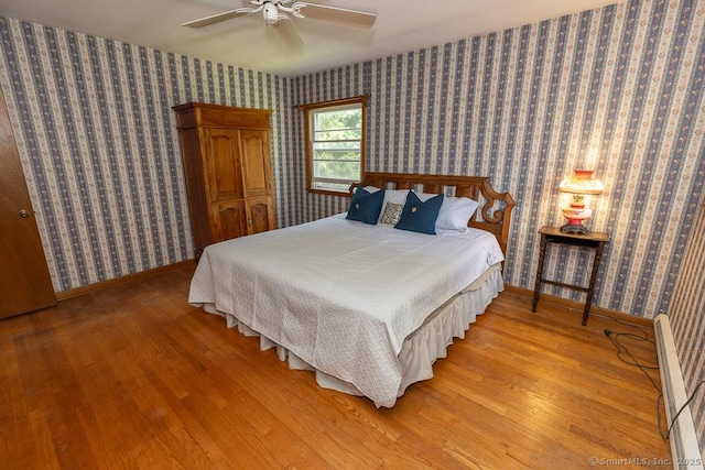 3 Glen Dr, Old Saybrook, CT 06475 - bedroom featuring wood finished floors, wallpapered walls, and a ceiling fan