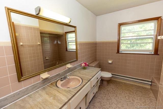 3 Glen Dr, Old Saybrook, CT 06475 - bathroom with baseboard heating, tile walls, vanity, tile patterned flooring, and wainscoting