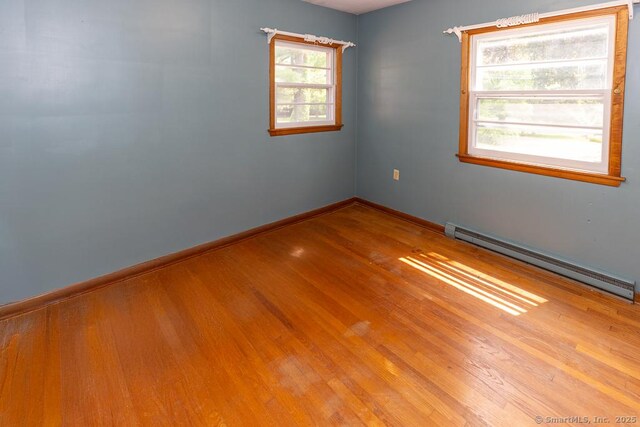 3 Glen Dr, Old Saybrook, CT 06475 - unfurnished room with baseboard heating and wood finished floors