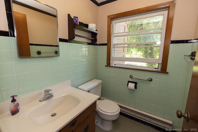 3 Glen Dr, Old Saybrook, CT 06475 - half bath with tile walls, tile patterned floors, vanity, a baseboard heating unit, and wainscoting