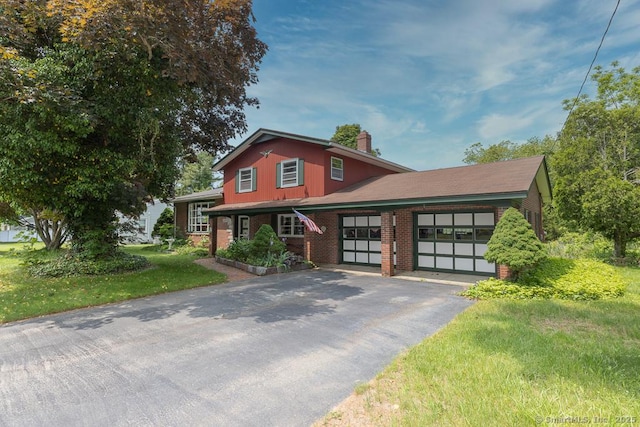 3 Glen Dr, Old Saybrook, CT 06475 - split level home featuring asphalt driveway, a garage, a chimney, brick siding, and a front lawn