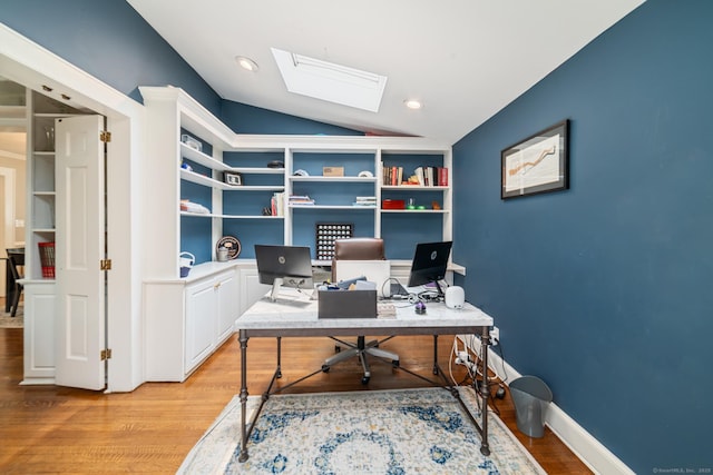 407 Meadowbrook Rd, Fairfield, CT 06824 - office area featuring lofted ceiling, light wood-style flooring, a skylight, and built in shelves