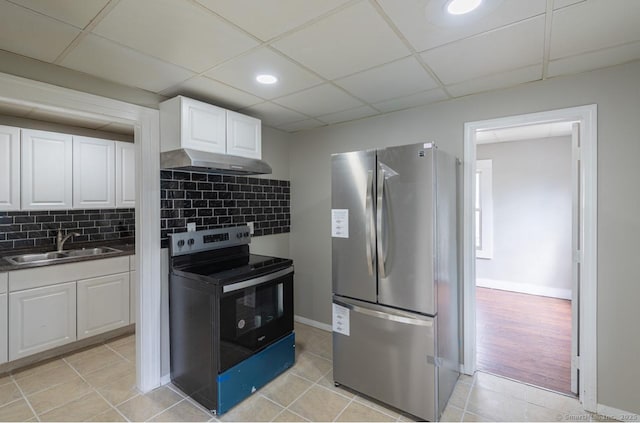 Pine St, Meriden, CT 06450 - kitchen featuring appliances with stainless steel finishes, a sink, under cabinet range hood, white cabinets, and a paneled ceiling