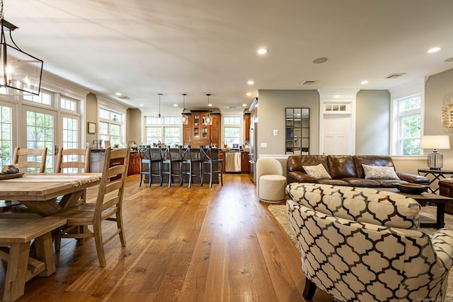 112 John Hand Dr, Coventry, CT 06238 - living room featuring recessed lighting, light wood finished floors, healthy amount of natural light, and a chandelier