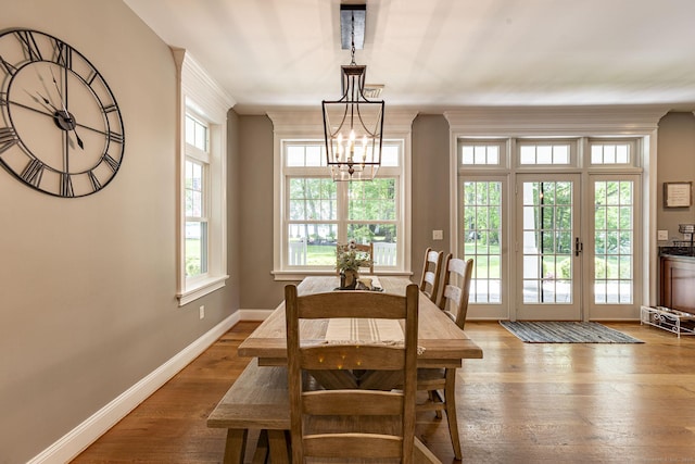 112 John Hand Dr, Coventry, CT 06238 - dining space with a chandelier, wood finished floors, baseboards, and ornamental molding