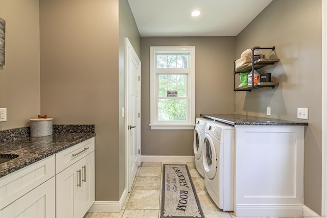 112 John Hand Dr, Coventry, CT 06238 - washroom with independent washer and dryer, cabinet space, and baseboards