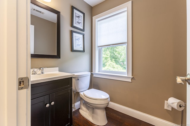 112 John Hand Dr, Coventry, CT 06238 - bathroom featuring baseboards, toilet, vanity, and wood finished floors