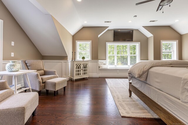 112 John Hand Dr, Coventry, CT 06238 - bedroom with vaulted ceiling, wainscoting, multiple windows, wood finished floors, and a decorative wall