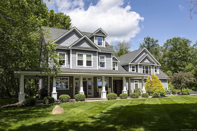 112 John Hand Dr, Coventry, CT 06238 - craftsman house featuring a shingled roof, a porch, and a front lawn