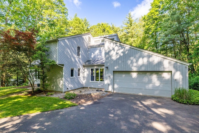 20 Roundhill Rd, Granby, CT 06035 - mid-century home with asphalt driveway and an attached garage