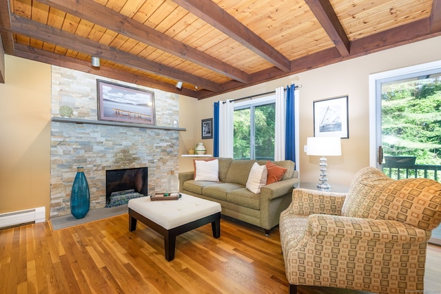 20 Roundhill Rd, Granby, CT 06035 - living room with plenty of natural light, wooden ceiling with exposed beams, wood finished floors, and a stone fireplace