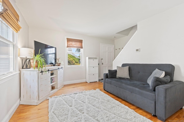 407 Sylvan Knoll Rd, Stamford, CT 06902 - living room featuring baseboards, light wood finished floors, and stairway