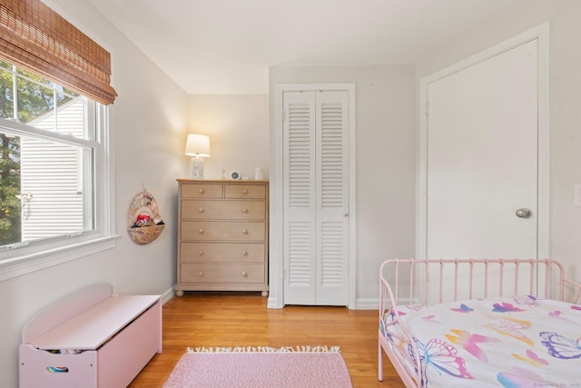 407 Sylvan Knoll Rd, Stamford, CT 06902 - bedroom with light wood finished floors, a closet, and baseboards