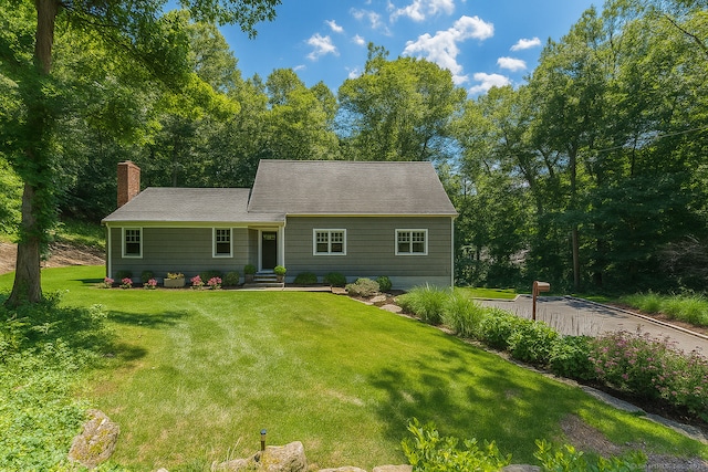 4 Berkeley Hl, Westport, CT 06880 - new england style home with a chimney, a front yard, entry steps, and a shingled roof