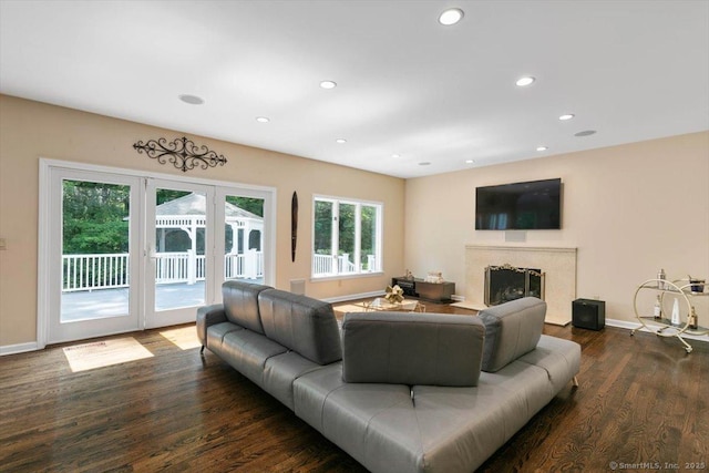 1 Mountaincrest Dr, Cheshire, CT 06410 - living area with a premium fireplace, wood finished floors, french doors, baseboards, and recessed lighting