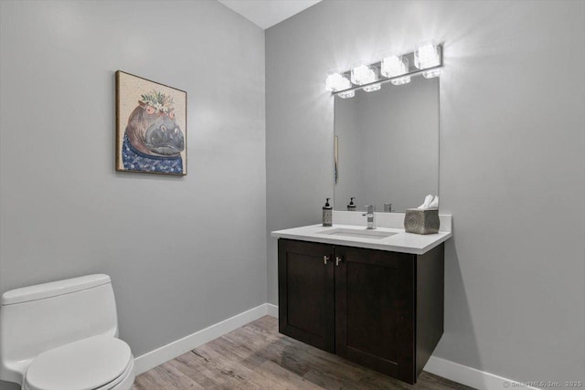 1 Mountaincrest Dr, Cheshire, CT 06410 - half bath with toilet, vanity, wood finished floors, and baseboards
