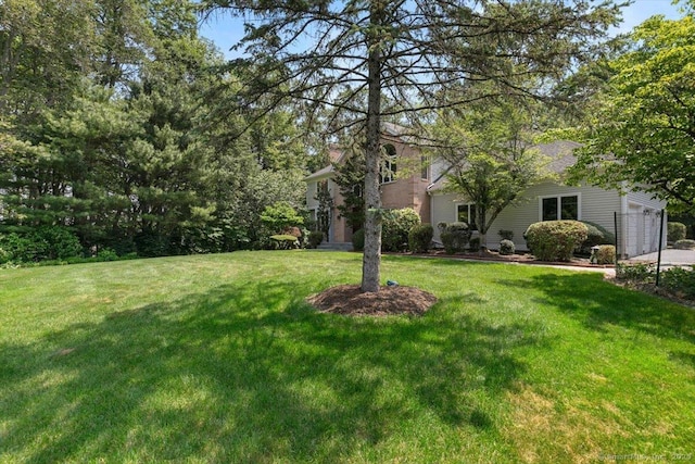 1 Mountaincrest Dr, Cheshire, CT 06410 - view of green lawn with an attached garage