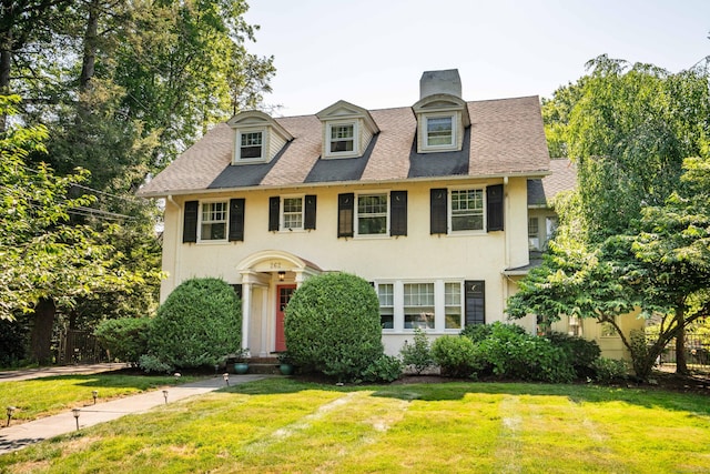 262 Kenyon St, Hartford, CT 06105 - view of front of home with stucco siding, a front yard, roof with shingles, and a chimney