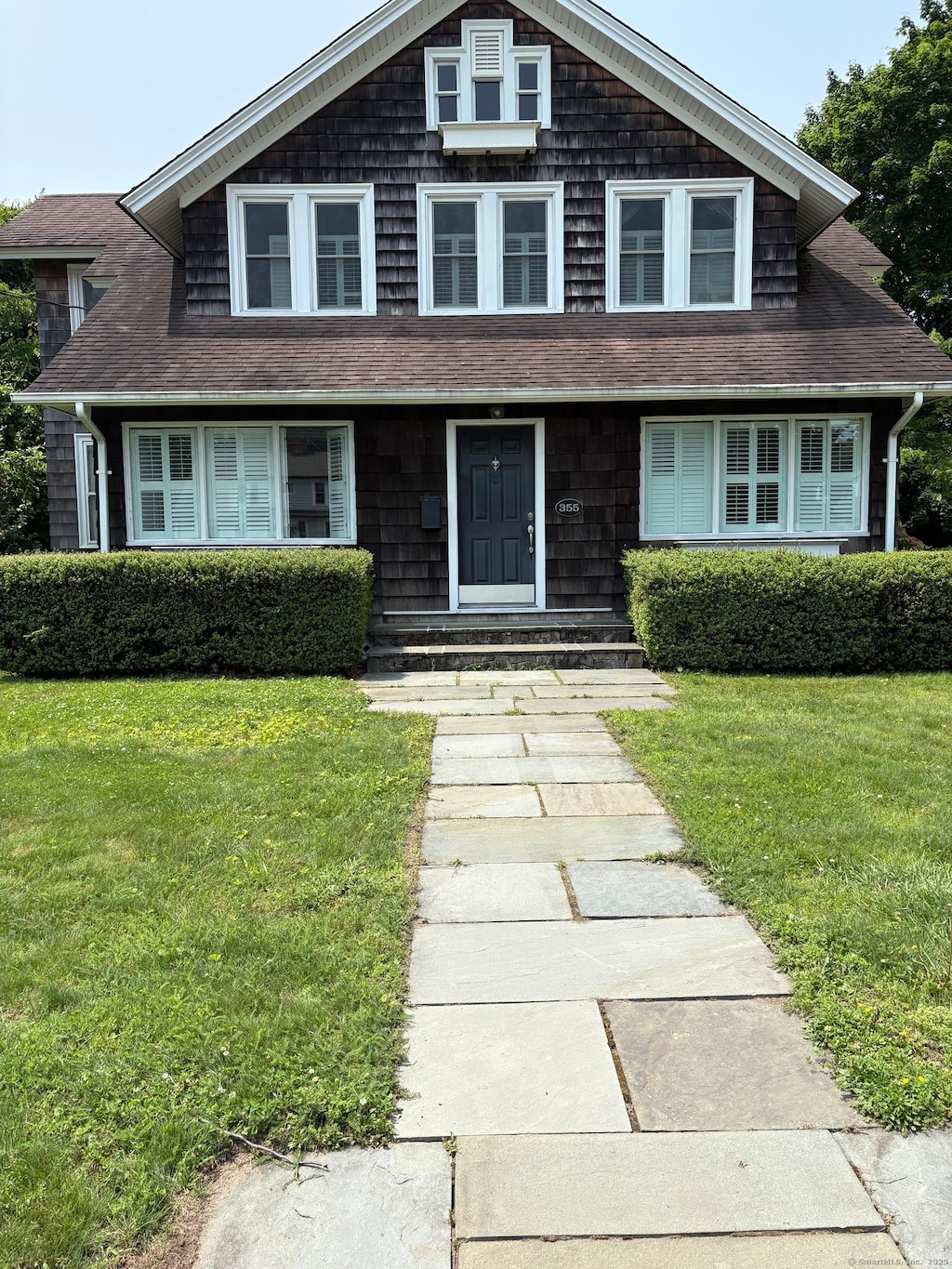 355 Main St, Old Saybrook, CT 06475 - shingle-style home featuring a front yard and roof with shingles