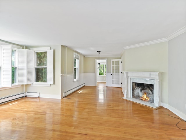 355 Main St, Old Saybrook, CT 06475 - unfurnished living room featuring a baseboard radiator, light wood finished floors, ornamental molding, and a high end fireplace
