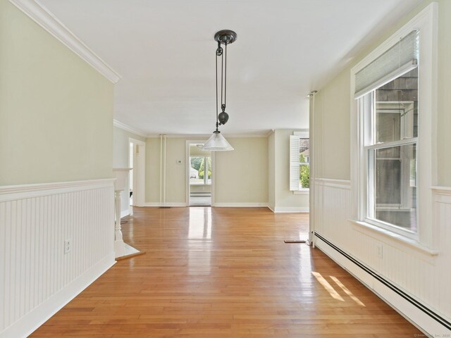 355 Main St, Old Saybrook, CT 06475 - unfurnished dining area with baseboard heating, a wainscoted wall, light wood-type flooring, and crown molding