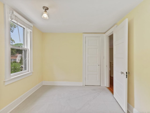 355 Main St, Old Saybrook, CT 06475 - unfurnished bedroom with baseboards and light colored carpet