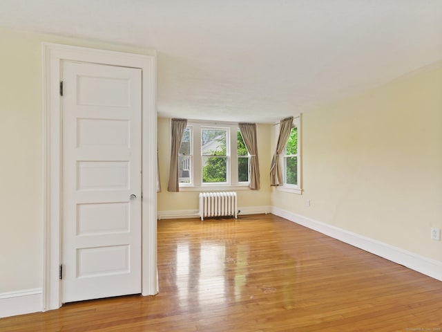 355 Main St, Old Saybrook, CT 06475 - empty room with radiator and light wood-type flooring