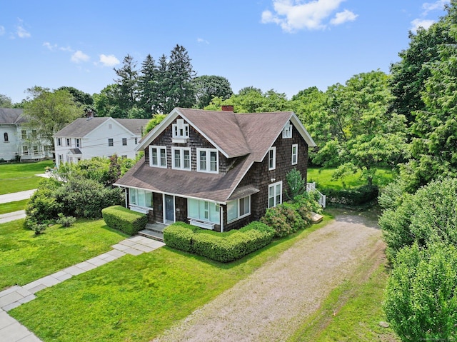 355 Main St, Old Saybrook, CT 06475 - shingle-style home with driveway, a chimney, roof with shingles, a front yard, and a porch