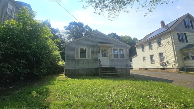215 Stanley St, New Britain, CT 06051 - view of front of home featuring entry steps and a front lawn