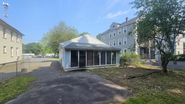 215 Stanley St, New Britain, CT 06051 - rear view of property with a sunroom