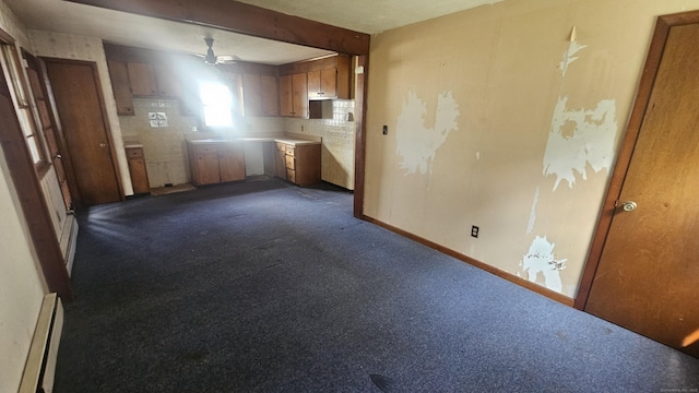215 Stanley St, New Britain, CT 06051 - kitchen featuring a ceiling fan, a baseboard radiator, dark carpet, and brown cabinets