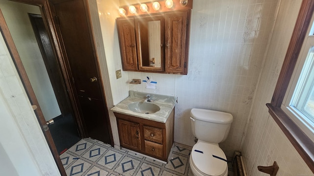 215 Stanley St, New Britain, CT 06051 - bathroom featuring toilet, vanity, and tile walls