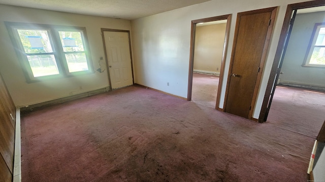 215 Stanley St, New Britain, CT 06051 - empty room with carpet flooring, baseboards, and a textured ceiling