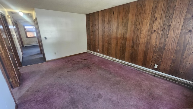 215 Stanley St, New Britain, CT 06051 - carpeted spare room with wooden walls, baseboard heating, and baseboards