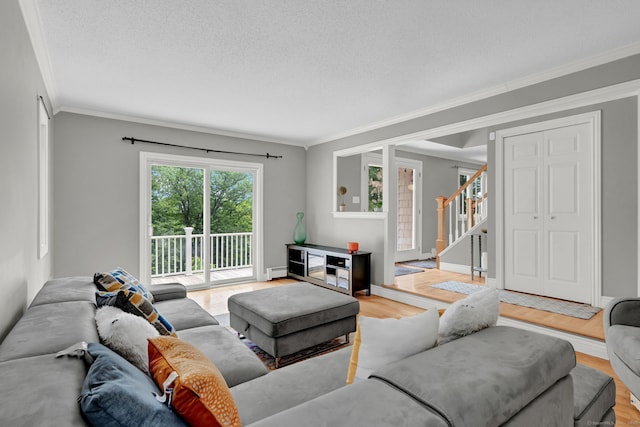 2 Pent Rd, Bloomfield, CT 06002 - living area featuring wood finished floors, ornamental molding, a baseboard radiator, stairs, and a textured ceiling