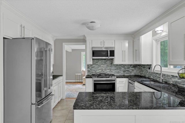 2 Pent Rd, Bloomfield, CT 06002 - kitchen with stainless steel appliances, tasteful backsplash, white cabinetry, dark stone counters, and a textured ceiling