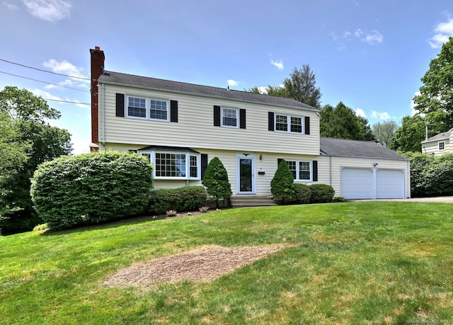 64 Regina St, Trumbull, CT 06611 - colonial house with a garage, a chimney, a front yard, driveway, and entry steps