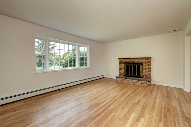 64 Regina St, Trumbull, CT 06611 - unfurnished living room featuring baseboard heating, wood finished floors, a brick fireplace, and baseboards