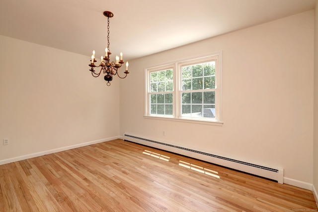 64 Regina St, Trumbull, CT 06611 - empty room featuring a baseboard heating unit, a chandelier, wood finished floors, and baseboards